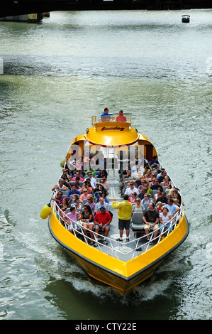 Chicago architectural tour boat loaded with tourists cruising the Chicago River. Stock Photo