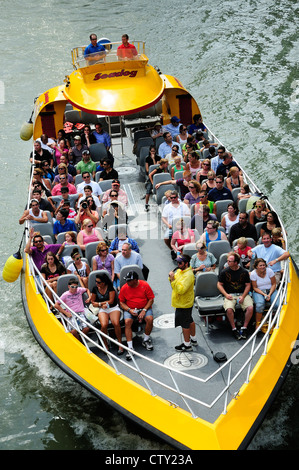 Chicago architectural tour boat loaded with tourists cruising the Chicago River. Stock Photo