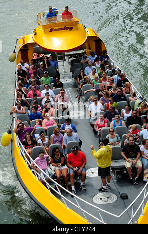 Chicago architectural tour boat loaded with tourists cruising the Chicago River. Stock Photo