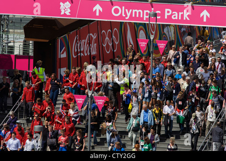 Aerial view of spectator crowds at the Westfield City shopping complex, Stratford that leads to the Olympic Park during the London 2012 Olympics, the 30th Olympiad. Large Coca-Cola ads line the walkway to the Olympic Park. Situated on the fringe of the 2012 Olympic park, Westfield is Europe's largest urban shopping centre. The £1.45bn complex houses more than 300 shops, 70 restaurants, a 14-screen cinema, three hotels, a bowling alley and the UK's largest casino. Stock Photo