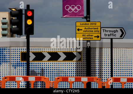 Street landscape near the Westfield City shopping complex, Stratford. On a new stretch of highway recently finished for those circumnavigating the perimeter of the Olympic park and its nearby shopping centre. The outer barrier of the Olympic Park is 2.5 sq km and circles a huge area of the borough of Stratford in the borough of Newham. The new landscape often looks incongruous to those living on many poor estates, excluded from the events. But this regeneration is the legacy by the government who promise a brighter future for this part of east London. Stock Photo