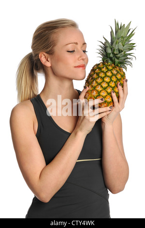 Beautiful young woman holding pineapple isolated over white background Stock Photo