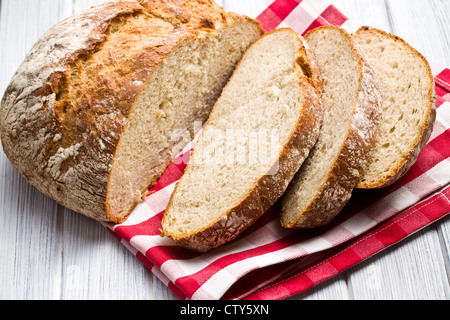 sliced bread on kitchen table Stock Photo