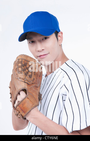 A baseball player wearing a glove Stock Photo