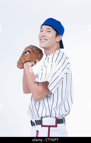A baseball player wearing a glove Stock Photo