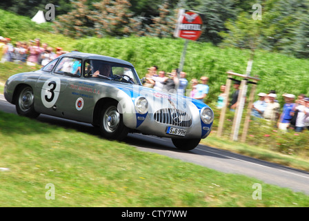 Herrmann Racing Ad Racing driver Hans Herrmann with a wheel Stock Photo - Alamy