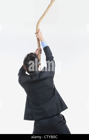 A man pulling the rope Stock Photo