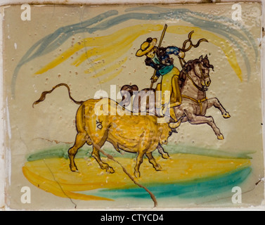 A Picador lancing a bull - a primitive painting on the wall of an old bull-ring in Extremadura, Central Spain Stock Photo