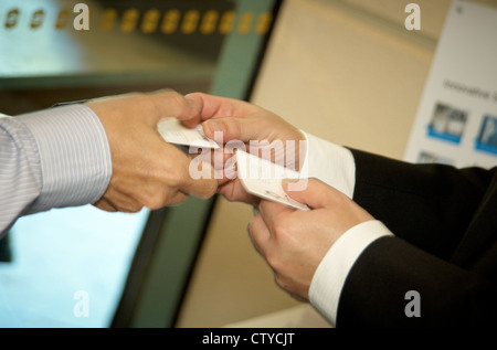 two businessmen exchanging business cards Stock Photo