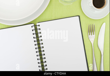 Recipe Book - Open Blank Diary on Set Table In Restaurant Stock Photo