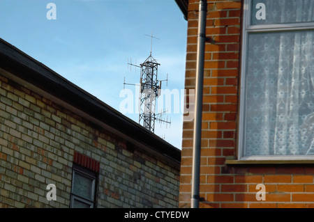 Mobile phone mast near dwellings. England UK. Stock Photo