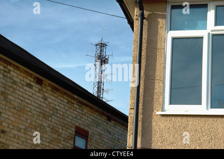 Mobile phone mast near dwellings. England UK. Stock Photo