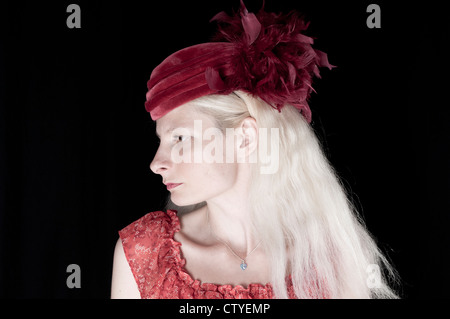 Portrait of a young woman with feather hat Stock Photo