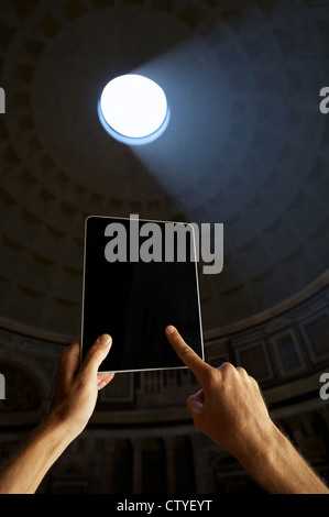 Tourist Uses Touchscreen Tablet Computer at Pantheon Rome Stock Photo