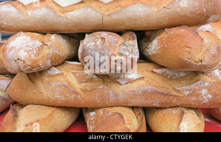 A stack of crusty French bread known as baguettes, batons, or French Sticks