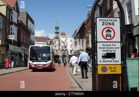 Road sign, South Street, Chichester town centre, restricting access to buses only. Chichester's Market Cross in the background.