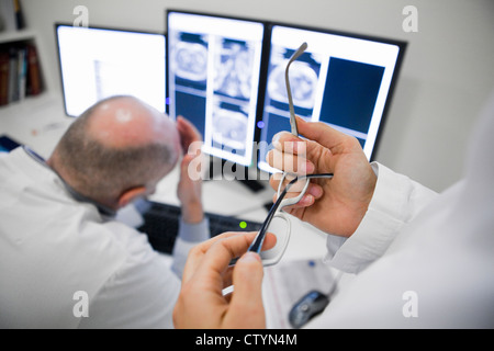 Radiologist discussing patients data Stock Photo