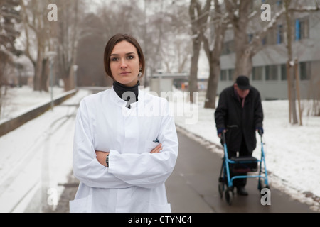 Young female doctor in hospital yard Stock Photo