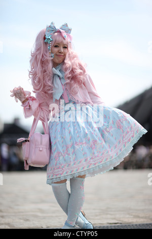 Girl in kawaii gothic clothes; lolita clothing; pretty pink