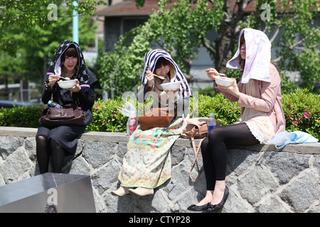 Japanese girls having lunch, in Tokyo, Japan Stock Photo