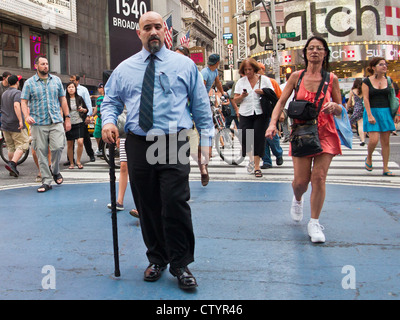 Pedestrians cross Broadway at Times Square. New York, New York, USA. 25-July-2012. Stock Photo