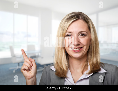smiling caucasian woman in modern office Stock Photo