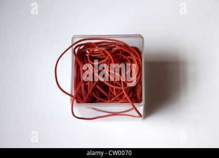 Red Elastic Bands in Container Stock Photo