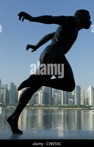 Statue of runner Henry 'Harry' Winston Jerome with Vancouver City  in the background. Stock Photo