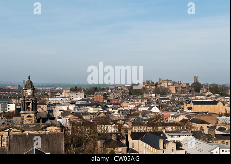 View over the city of Lancaster, UK, seen from the tower of St Peter's Cathedral, with the old prison of Lancaster Castle in the background Stock Photo