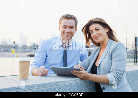 Business people using tablet computer
