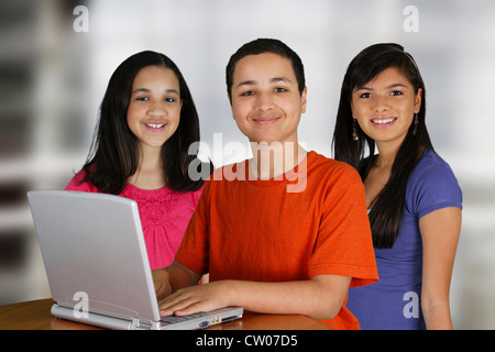 Group of children using a computer at school Stock Photo