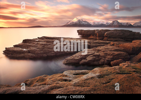 Sun falls on an March evening over the Cuillin mountains on The Isle of Skye  Highland Scotland Stock Photo