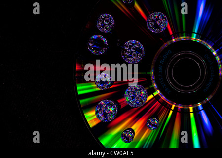 drops of water on CD with light beams Stock Photo