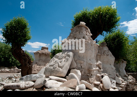 A pile of smooth and carved stones and decaying chortons by the side of the road in Stok, Ladakh, India. Stock Photo