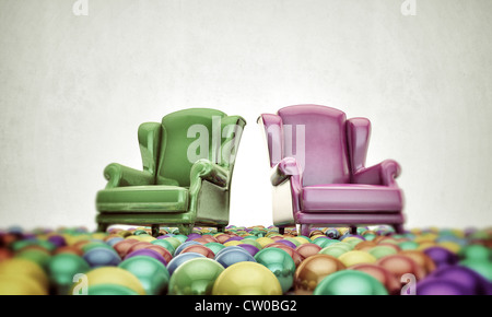 armchairs in old picture with colored balls around Stock Photo