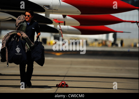 Technical Sgt. Amber Alumpe, an aircrew flight equipment specialist, gathers flight gear for post-flight inspection at the Portland Air National Guard Base, Aug. 3, 2012. Stock Photo