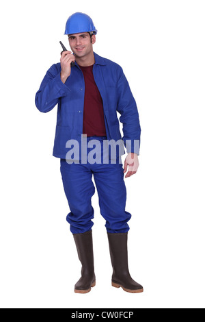 craftsman using his walkie talkie Stock Photo