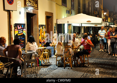 Portugal - Madeira - Funchal Zona Velha - vibrant cafe + restaurant life - under the back street lights Stock Photo