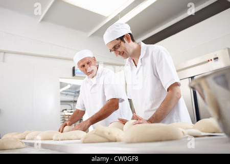 Chefs baking in kitchen Stock Photo
