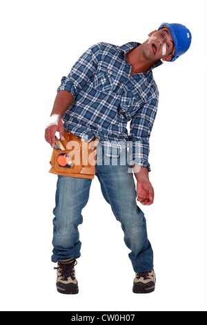 Tradesman suffering from a work-related injury Stock Photo