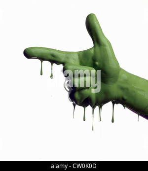 Green painted hand pointing Stock Photo