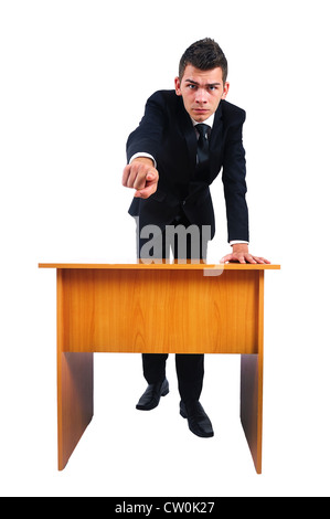 Isolated business man pointing at desk Stock Photo