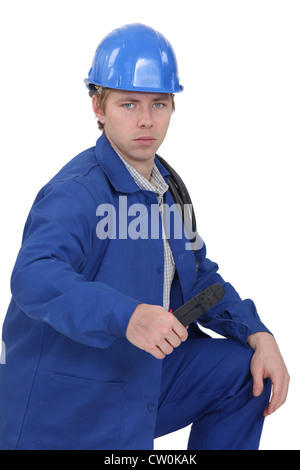 Young laborer, studio shot Stock Photo