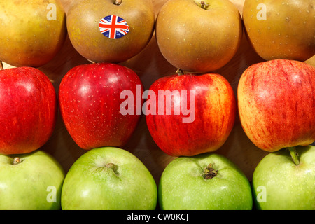 Three different types of apple grown in the UK  with Union Flag sticker Stock Photo