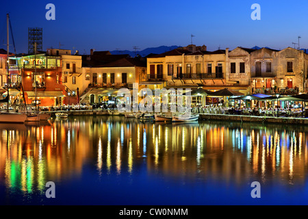 The old Venetian harbor of Rethymno town around the 'blue' hour. Crete island, Greece. Stock Photo