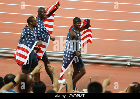Taylor Clement and Jackson take a victory lap after USA sweeps men's 400 meter hurdles winning gold silver bronze medals Stock Photo