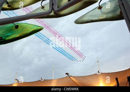 Red Arrows at The London 2012 Olympics Opening Ceremony day above the Olympic Park in Stratford, London, UK. Stock Photo