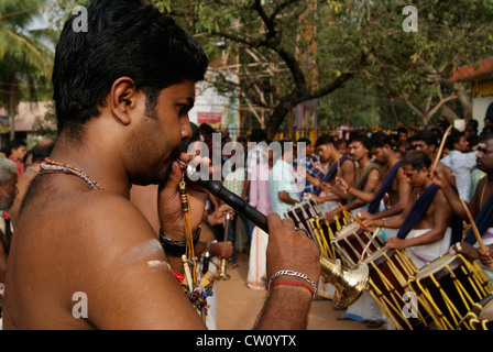 Traditional Flute paying artist playing Music in chenda melom panchavadyam drums Playing team of Kerala Musical Art forms India Stock Photo