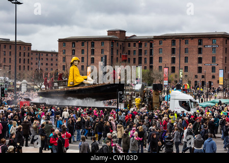 Little Girl giant making her way through Liverpool city centre as part of the 3-day street theatre event. Stock Photo
