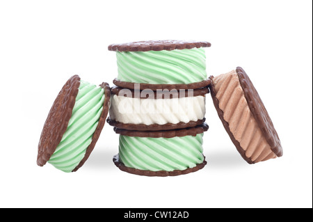 A collection of chocolate, vanilla and mint ice cream sandwiches on a white background. Stock Photo